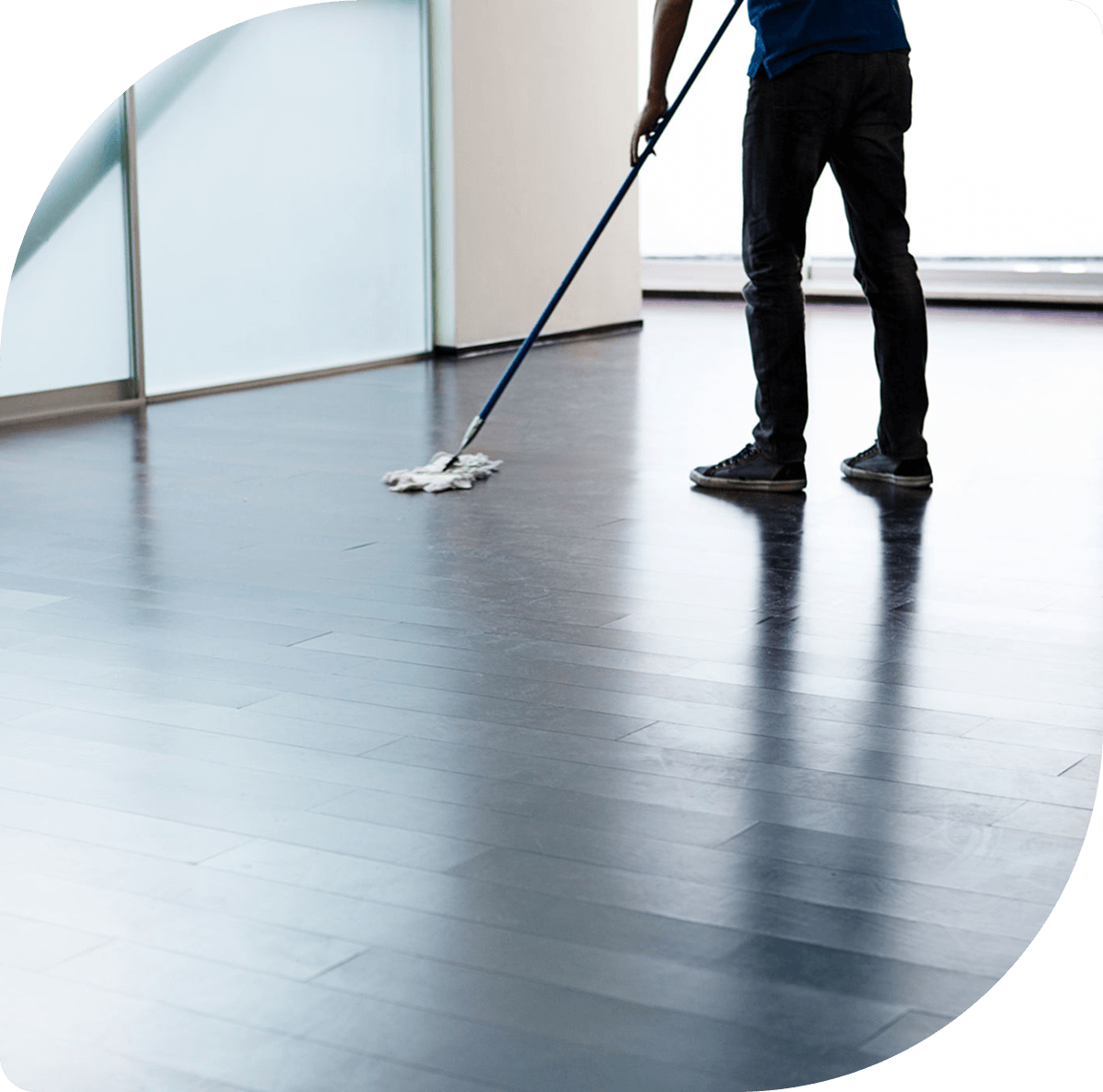 Man maintaining a polished hardwood floor